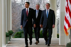 US President Barack Obama (L) former President Bill Clinton (C) and former President George W. Bush (R) walk to the Rose Garden